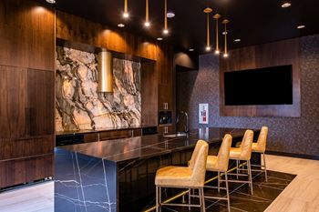 State of the Art Kitchen with dark marble and waterfall countertops at The Residences at Galleria, Kansas